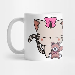 Cute tabby cat holds a teddy bear Mug